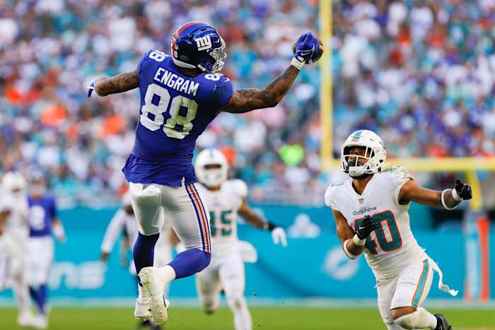 Dec 5, 2021; Miami Gardens, Florida, USA; New York Giants tight end Evan Engram (88) attempts a one-handed catch against Miami Dolphins free safety Nik Needham (40) during the second half at Hard Rock Stadium. Mandatory Credit: Sam Navarro-USA TODAY Sports